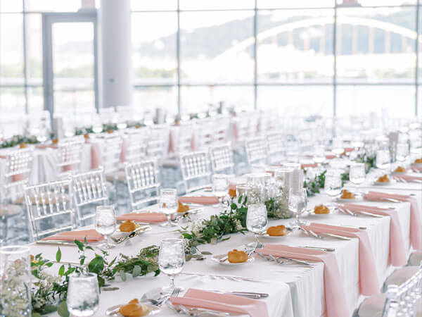 Room filled elegant round tables and chairs.